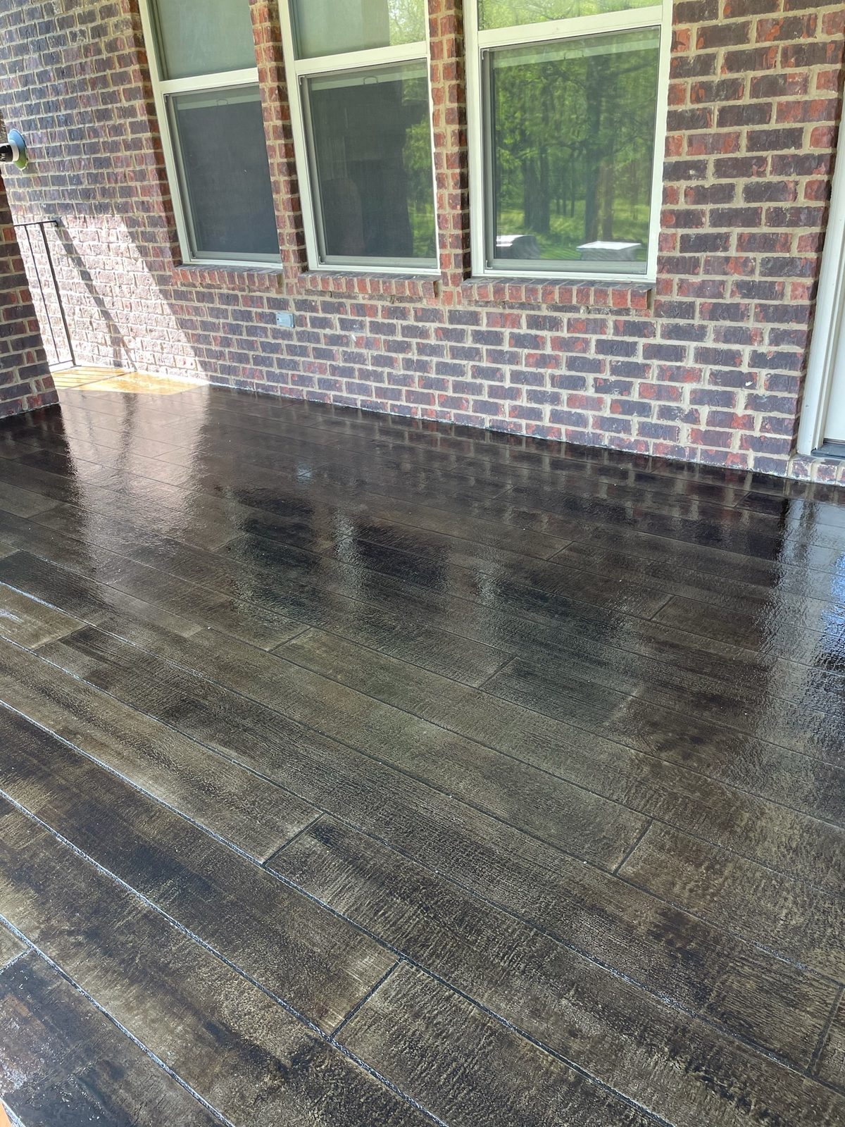Cascina hand-stenciled wood-plank microcement finish on a covered porch — Franklin