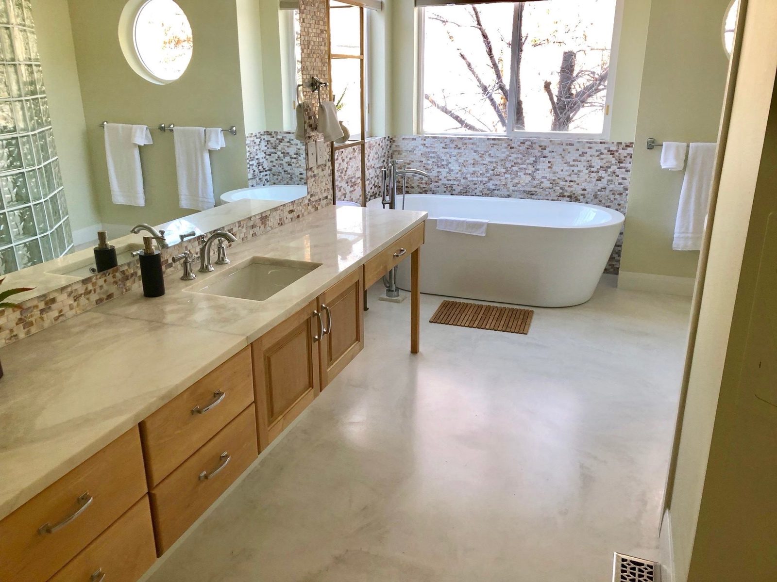 Seamless microcement bathroom with freestanding tub — Nashville, 186 sq ft