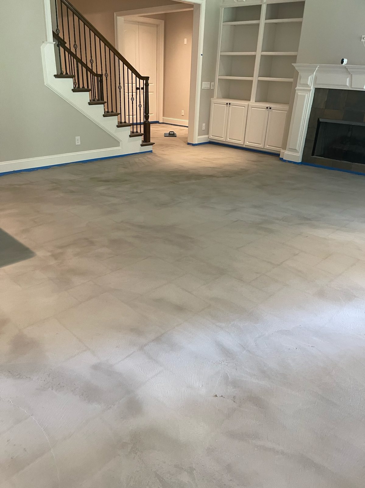 Velluto hand-troweled microcement floor across a great room — Brentwood